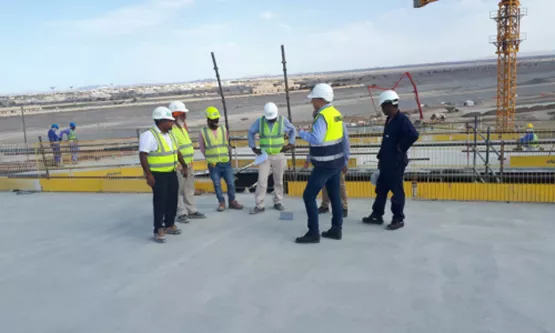 Wroker at jobsite discussing startup